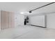 Spacious garage with built-in storage cabinets and extra space at 19039 N 90Th Ln, Peoria, AZ 85382