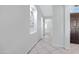 Bright hallway with tile floors and access to other rooms at 19039 N 90Th Ln, Peoria, AZ 85382