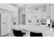 Updated kitchen with white cabinets, quartz countertops, and stainless steel appliances at 19039 N 90Th Ln, Peoria, AZ 85382