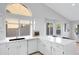 Spacious kitchen boasts white cabinetry, quartz countertops, and a breakfast bar at 19039 N 90Th Ln, Peoria, AZ 85382