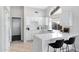 Modern kitchen with white cabinets and a large island at 19039 N 90Th Ln, Peoria, AZ 85382