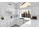 Modern kitchen with white cabinets, stainless steel appliances, and an island at 19039 N 90Th Ln, Peoria, AZ 85382