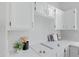 Clean kitchen features white cabinets and a new cooktop at 19039 N 90Th Ln, Peoria, AZ 85382