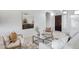 Living room with large windows, modern furniture, and a neutral color scheme at 19039 N 90Th Ln, Peoria, AZ 85382