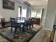 Bright dining room featuring a large table and wood flooring at 25409 N 40Th N Ln # 0, Phoenix, AZ 85083