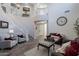 Open living space with high ceilings, a grand staircase, and a fireplace at 26203 N 50Th Dr, Phoenix, AZ 85083