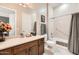 Clean bathroom with a tub, shower, and updated vanity at 27046 W Yukon Dr, Buckeye, AZ 85396