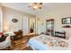Bright bedroom with hardwood floors and built-in shelving at 27046 W Yukon Dr, Buckeye, AZ 85396