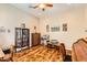 Bright home office with hardwood floors and built-in bookcases at 27046 W Yukon Dr, Buckeye, AZ 85396