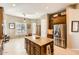 Updated kitchen with granite island, stainless steel appliances, and ample cabinet space at 27046 W Yukon Dr, Buckeye, AZ 85396