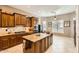 Spacious kitchen with granite countertops and wooden cabinetry at 27046 W Yukon Dr, Buckeye, AZ 85396