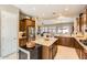 Modern kitchen with granite countertops, stainless steel appliances, and an island at 27046 W Yukon Dr, Buckeye, AZ 85396