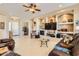 Living room with built-in shelving, a fireplace and comfortable seating at 27046 W Yukon Dr, Buckeye, AZ 85396