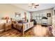 Main bedroom with hardwood floors and a ceiling fan at 27046 W Yukon Dr, Buckeye, AZ 85396