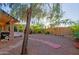 Landscaped backyard with gravel, stone pathway, and mature trees at 3846 N Kings Peak --, Mesa, AZ 85215