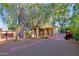 Relaxing backyard oasis with patio, seating area, and mature trees at 3846 N Kings Peak --, Mesa, AZ 85215