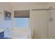 Bathroom with soaking tub and shower, and a large window at 3846 N Kings Peak --, Mesa, AZ 85215