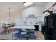 Bright kitchen with island, white cabinets, and stainless steel appliances at 3846 N Kings Peak --, Mesa, AZ 85215