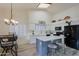 Bright kitchen with island, white cabinets, and stainless steel appliances at 3846 N Kings Peak --, Mesa, AZ 85215