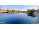 Peaceful lake view with lush greenery and homes nearby at 3846 N Kings Peak --, Mesa, AZ 85215