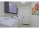 Bright laundry room with washer, dryer, and upper cabinets at 3846 N Kings Peak --, Mesa, AZ 85215