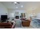 Living room with a fireplace and leather furniture at 3846 N Kings Peak --, Mesa, AZ 85215