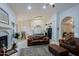 Open concept living space with a kitchen and fireplace at 3846 N Kings Peak --, Mesa, AZ 85215
