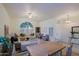 Spacious living area featuring light wood floors and a dining table at 3846 N Kings Peak --, Mesa, AZ 85215