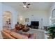 Living room with leather furniture and a large TV at 3846 N Kings Peak --, Mesa, AZ 85215