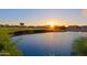 Sunset view over a pond with bordering homes at 3846 N Kings Peak --, Mesa, AZ 85215
