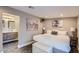 Spacious bedroom with a king-size bed and en-suite bathroom at 8310 E Devonshire Ave, Scottsdale, AZ 85251
