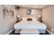 Cozy bedroom with a queen-size bed and stylish wall art at 8310 E Devonshire Ave, Scottsdale, AZ 85251