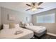 Bedroom with two double beds and ceiling fan at 8310 E Devonshire Ave, Scottsdale, AZ 85251