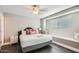 King-size bed in bedroom with window seat at 8310 E Devonshire Ave, Scottsdale, AZ 85251