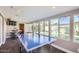 Game room with ping pong table, pool view, and wet bar at 8310 E Devonshire Ave, Scottsdale, AZ 85251