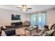 Bright and airy living room featuring a glass coffee table and comfy seating at 8310 E Devonshire Ave, Scottsdale, AZ 85251