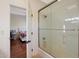 Bathroom features a shower/tub combo and a view into a bedroom at 1044 W Indian Hills Pl, Phoenix, AZ 85023