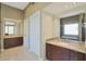 Elegant bathroom with dual vanities, a soaking tub, and a walk-in shower at 1044 W Indian Hills Pl, Phoenix, AZ 85023