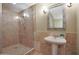 Spa-like bathroom with walk-in shower and pedestal sink at 1044 W Indian Hills Pl, Phoenix, AZ 85023
