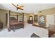 Primary bedroom with a large bed, ensuite bathroom and walk-in closet at 1044 W Indian Hills Pl, Phoenix, AZ 85023