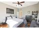 Well-lit bedroom featuring a comfortable bed and built-in desk at 1044 W Indian Hills Pl, Phoenix, AZ 85023