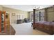 Main bedroom with large windows, patio access and ensuite bath at 1044 W Indian Hills Pl, Phoenix, AZ 85023