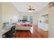 Spacious main bedroom with wood floors and private access to a deck at 1044 W Indian Hills Pl, Phoenix, AZ 85023