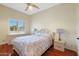 Bright bedroom with wood floors, and a ceiling fan at 1044 W Indian Hills Pl, Phoenix, AZ 85023