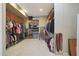 Spacious walk-in closet with custom shelving and rod system at 1044 W Indian Hills Pl, Phoenix, AZ 85023