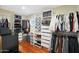 Large walk-in closet with ample shelving and hanging space at 1044 W Indian Hills Pl, Phoenix, AZ 85023