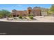 Beautiful two-story house with a long driveway and desert landscape at 1044 W Indian Hills Pl, Phoenix, AZ 85023