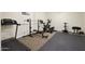 Home gym with a treadmill, elliptical, and weight bench at 1044 W Indian Hills Pl, Phoenix, AZ 85023