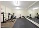Well-equipped home gym featuring various exercise machines at 1044 W Indian Hills Pl, Phoenix, AZ 85023