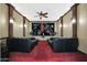 Home theater with seating for multiple viewers and large screen at 1044 W Indian Hills Pl, Phoenix, AZ 85023